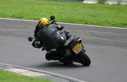 mike of dirty roses midlands rock covers band riding triumph tiger round cadwell park